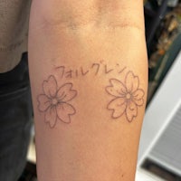 japanese flower tattoo on the forearm