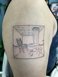 a tattoo on the arm of a person with a picture of a kitchen